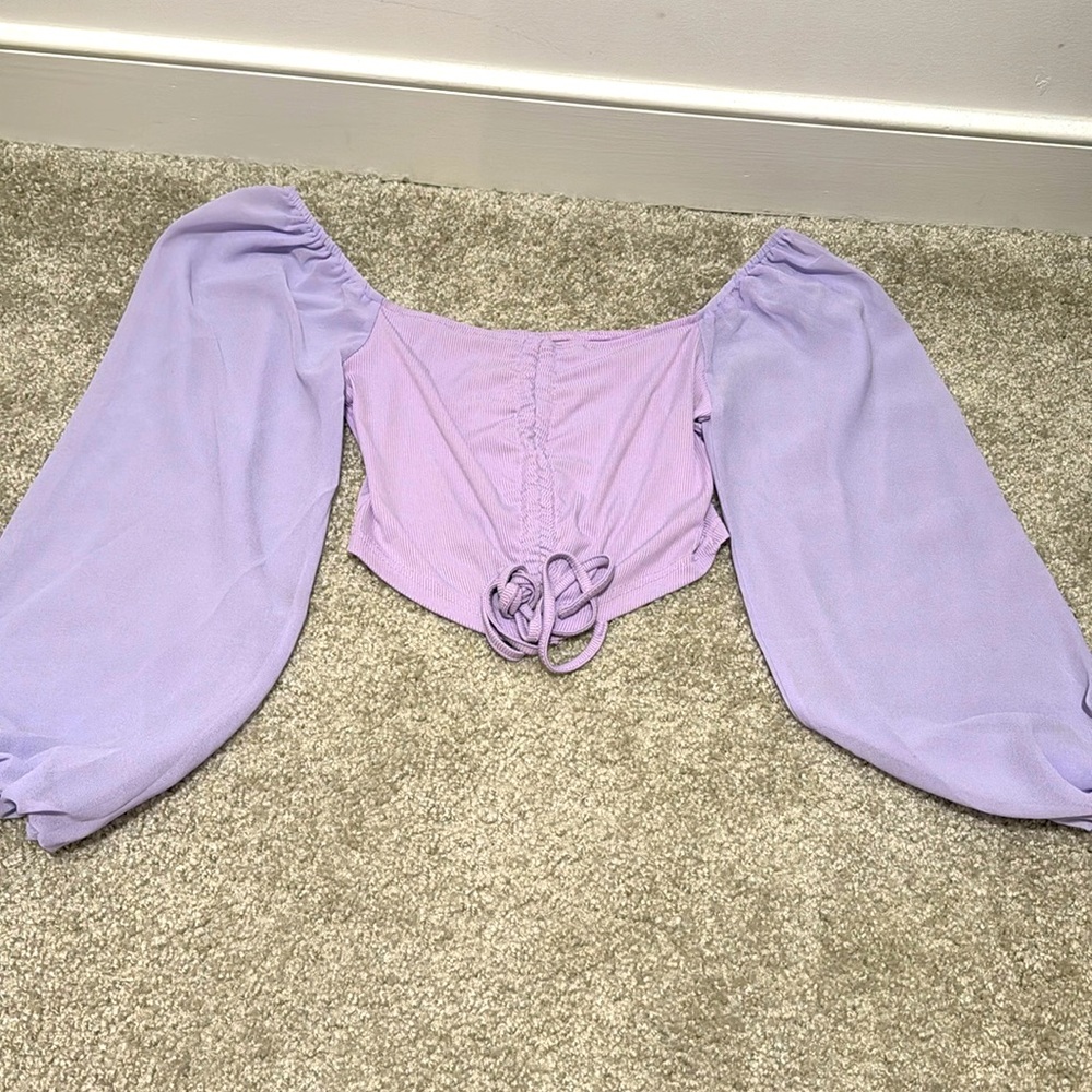 Lavender cropped shirt.